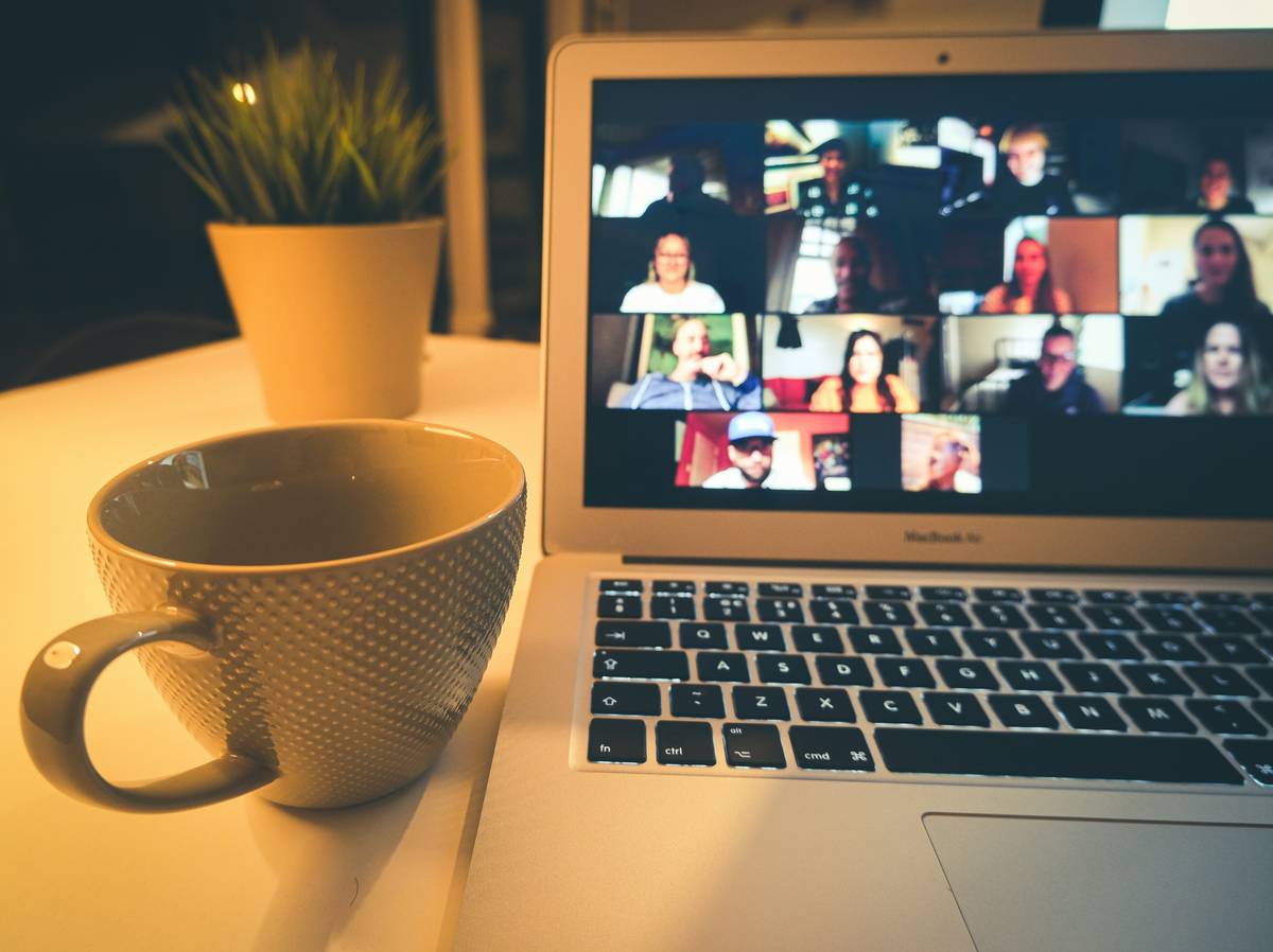 Diverse group of professionals collaborating online with cultural sensitivity intercultural competence training is essential for global teamwork